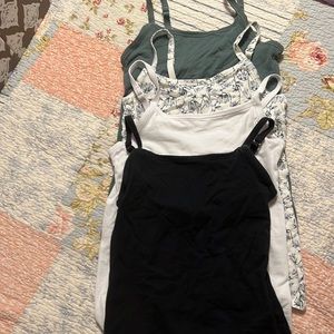 Four Duluth tanks tops with built in shelf bra.
